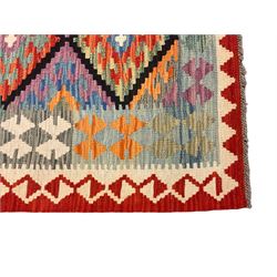 Anatolian Turkish Kilim multi-colour rug, decorated with all over lozenges in contrasting colours with dark indigo outline, the multi-band ivory and red border with repeating geometric shapes and small lozenges or diamonds