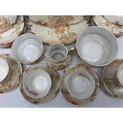 Early 20th century Limoges part tea service, decorated with floral sprays and gilt on merging peach and white ground, comprising six teacups, twelve side plates, six smaller plates, milk jug, open sucrier, slop bowl and two cake plates, many marked R Delinieres Limoges D&C France to base