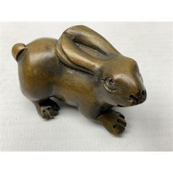 Seven netsuke, modelled as a cat, rat, pig, deer, cow and calf, turtle and rabbit