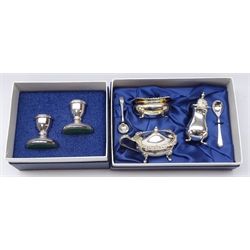  Shop stock: three piece silver-plated condiment set & pair of silver-plated dwarf candlesticks, both cased by Laurence R. Watson & Co. boxed  