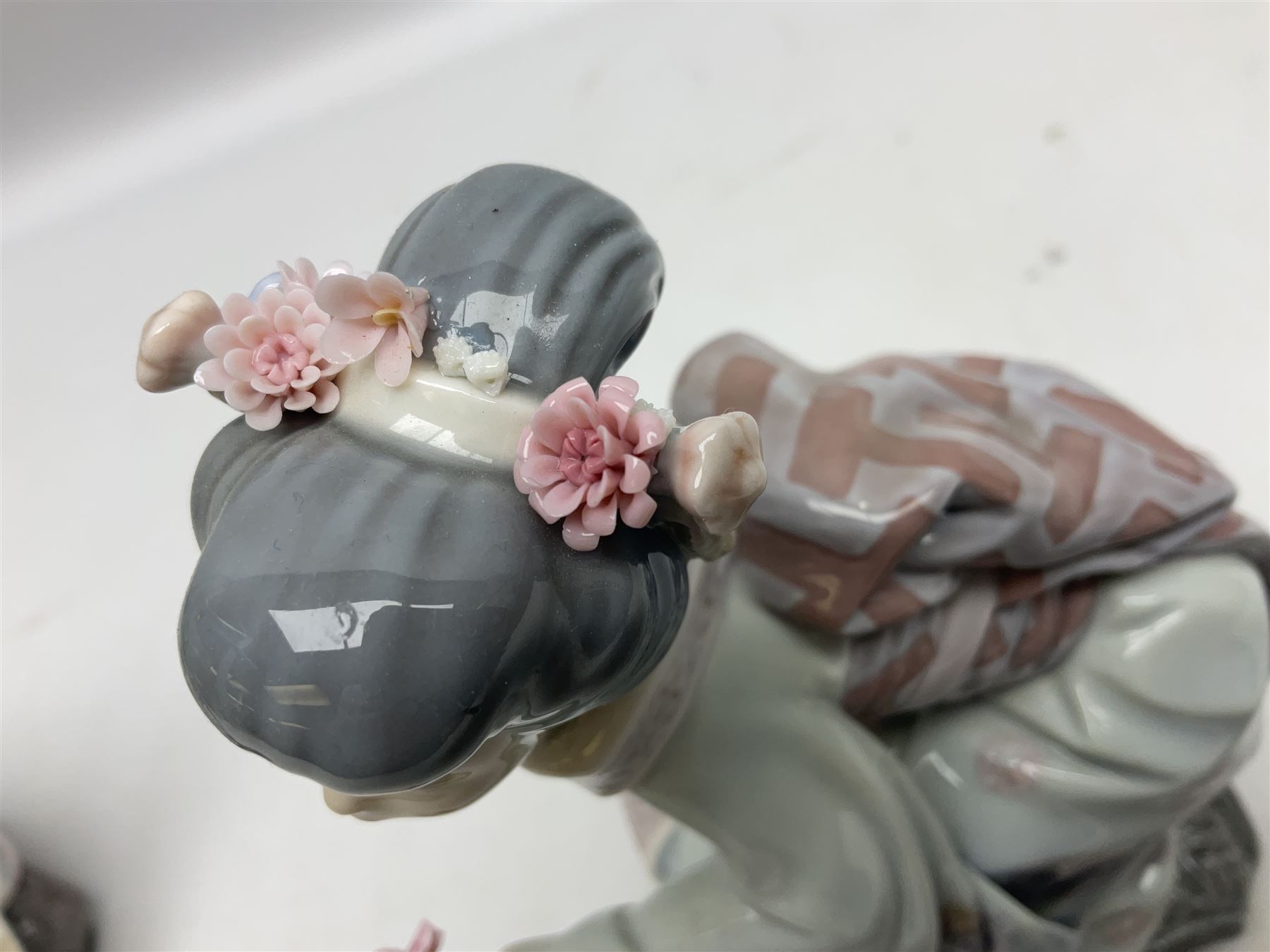 Two Lladro Japanese Ladies figures, comprising Kiyoko no 1450 and Yuki no 1448, both issued 1983, retired 1998, largest example H20cm