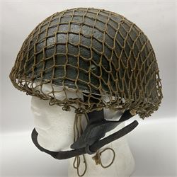 WW2 British Airborne Troops/Paratroopers Steel Helmet with green textured paint finish and netting cover, leather and sponge liner and three point chinstrap mounting; liner marked BMB 1943; together with a paratrooper's maroon beret with metal badge (2)