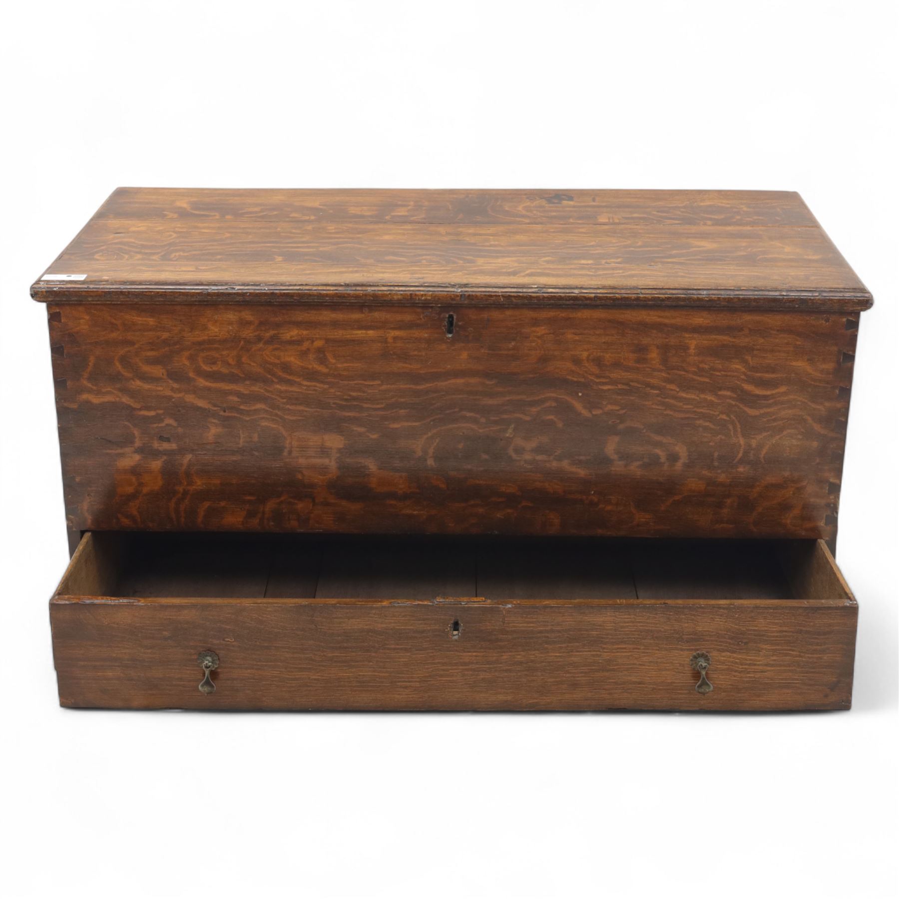 19th century oak blanket chest, rectangular hinged plank top with moulded edge, plain sides fitted with iron carrying handles, single full-width drawer to base with brass drop handles, on moulded plinth base