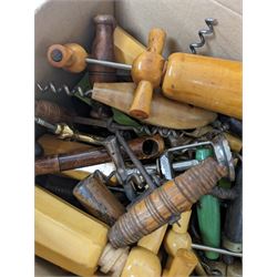Collection of approximately fifty seven corkscrews, including turned wooden and metal examples
