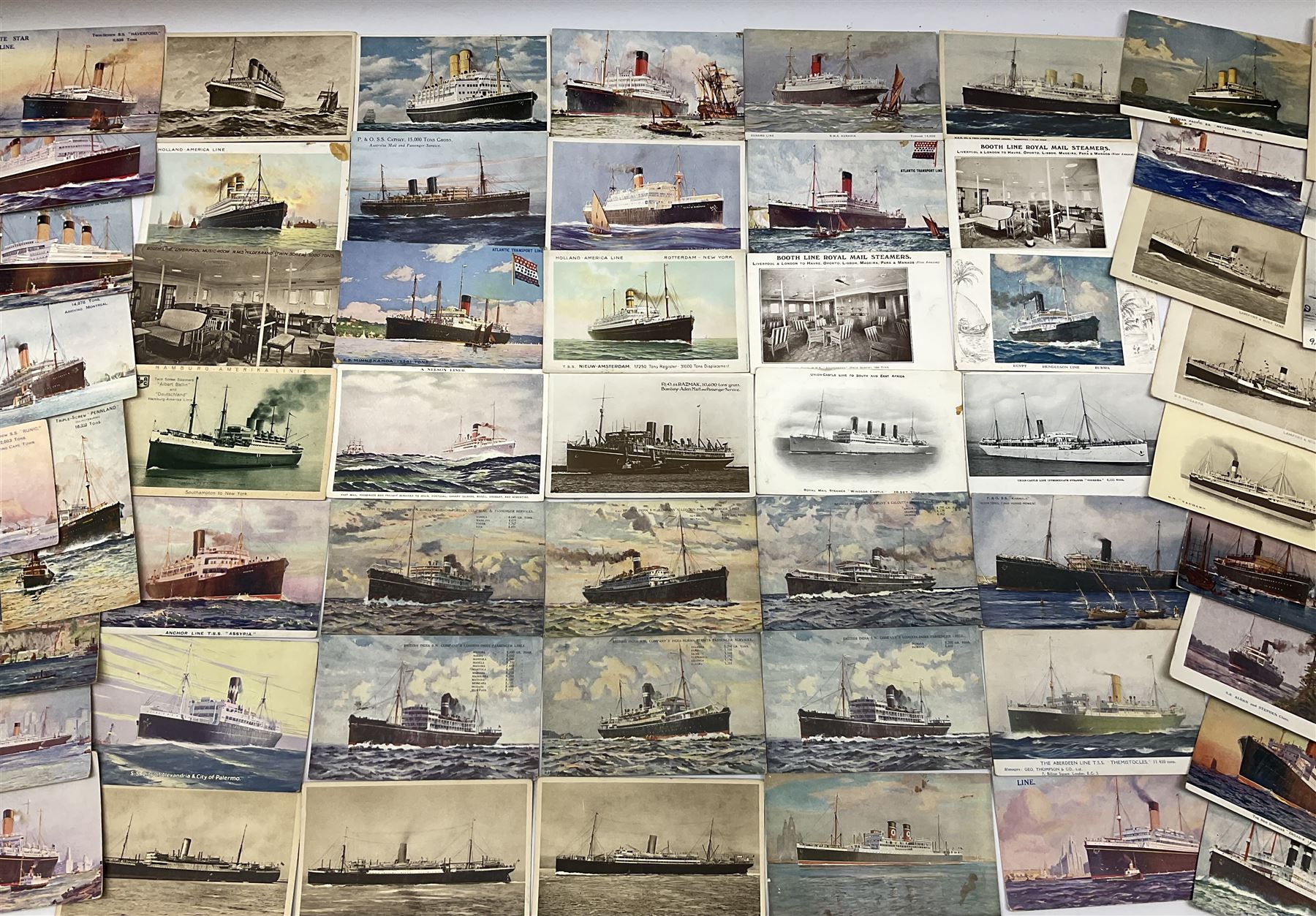 Sixty-five early 20th century postcards of passenger liners including White Star, Red Star, Atlantic Transport, Anchor, Cunard, Henderson, Booth, Union Castle, Holland America, Lamport & Holt, P. & O., New Zealand, Canadian Pacific, British India etc; and ten Edwardian postcards of Naval warships and officers (75)