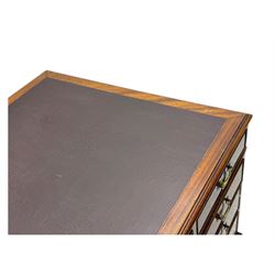 Edwardian mahogany twin pedestal desk, rectangular burgundy leather top moulded edge, over three short drawers with brass swan neck handles, over twin pedestals with graduating drawers supported on bracket feet