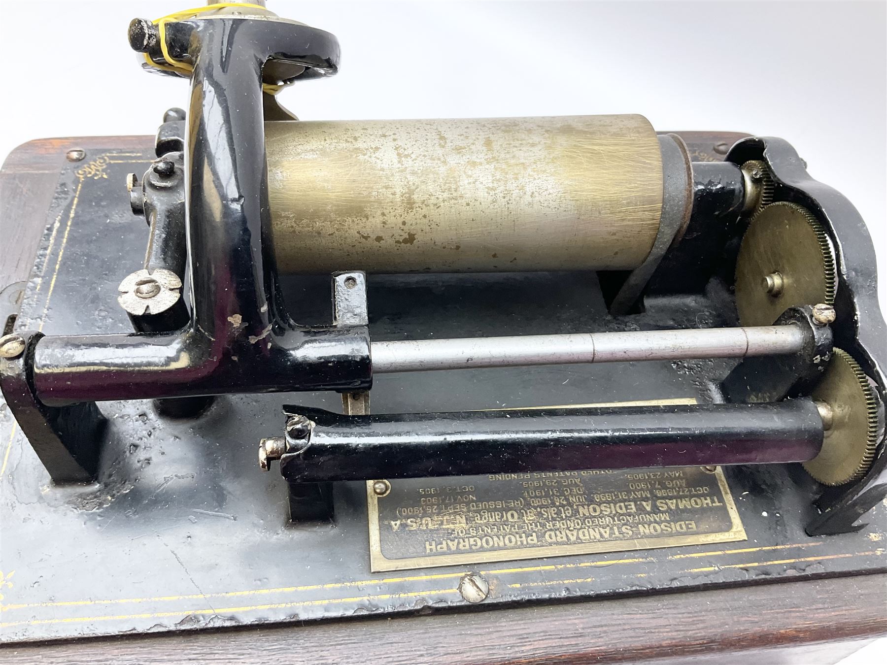 Edison Standard Phonograph with oak base (no cover), the reproducer marked 'Model C', serial no. 634857, last patent date Oct.1905, with black japanned conical horn L33cm; together with five cylinders