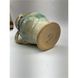 Early 20th century Royal Doulton Brangwyn Ware jug and set of six beakers, designed by Frank Brangwyn RA, all decorated in the Harvest pattern with stylised leaves and fruit on mottled peach and green ground, all with printed marks beneath, date code for 1920s, largest H18cm