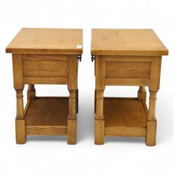 Old Charm - ‘Chatsworth’ pair of light oak lamp tables, each with moulded rectangular top, single drawer and metal drop handle, raised on turned supports joined by undertier shelves