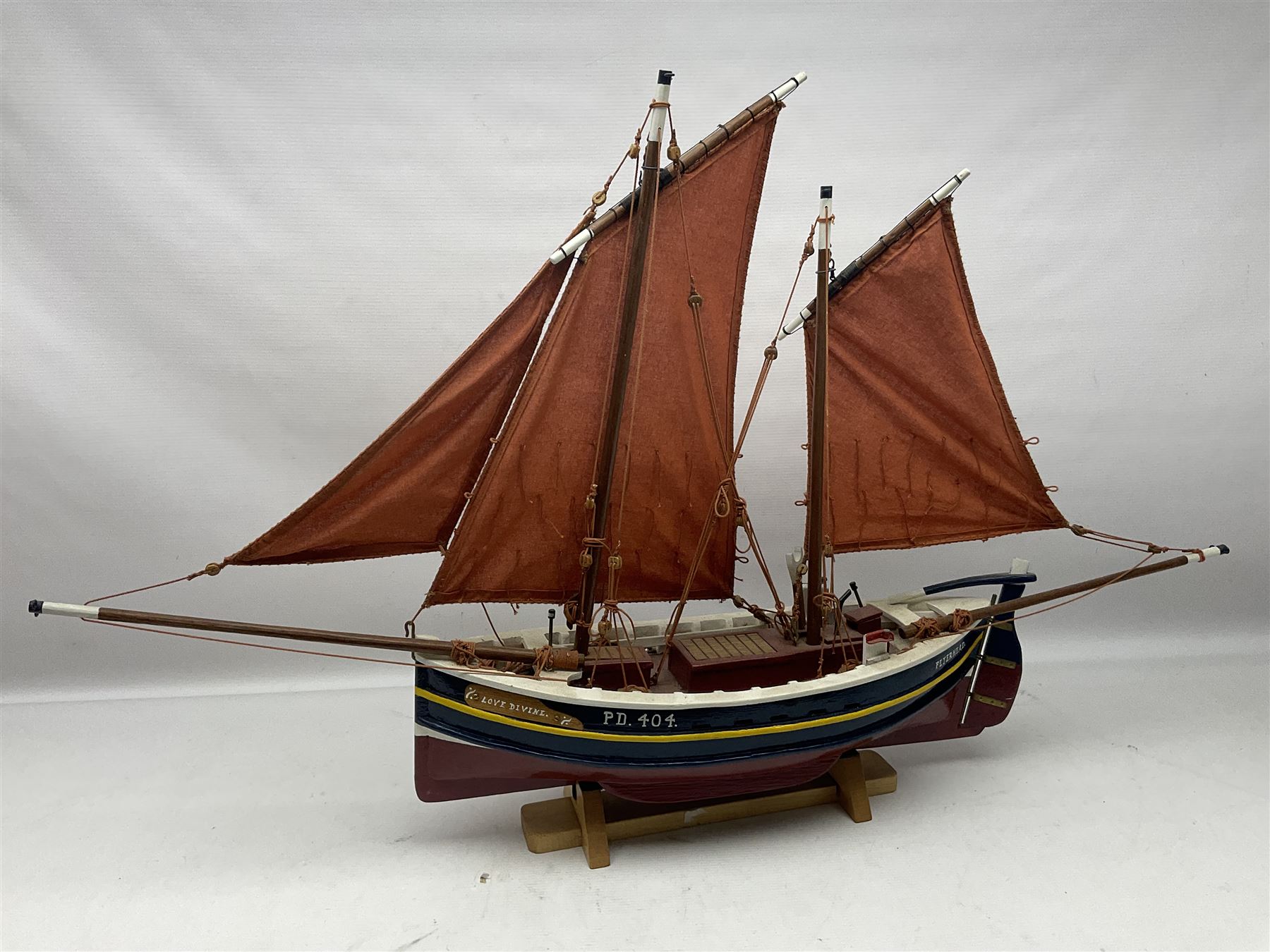 Wooden model of the Peterhead Herring Fishing Boat, Love Divine, PD404. on stand together with Wick Herring Fishing Boat, Galilee WK.1. on stand, L105cm, H64cm