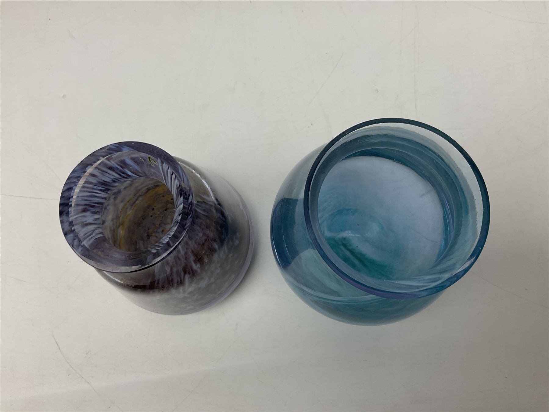 Three millefiori paperweights, together with a green glass dump paperweight with air bubble inclusions, Caithness Daisy and Cauldron paperweights and two small Caithness glass vases, tallest H9cm