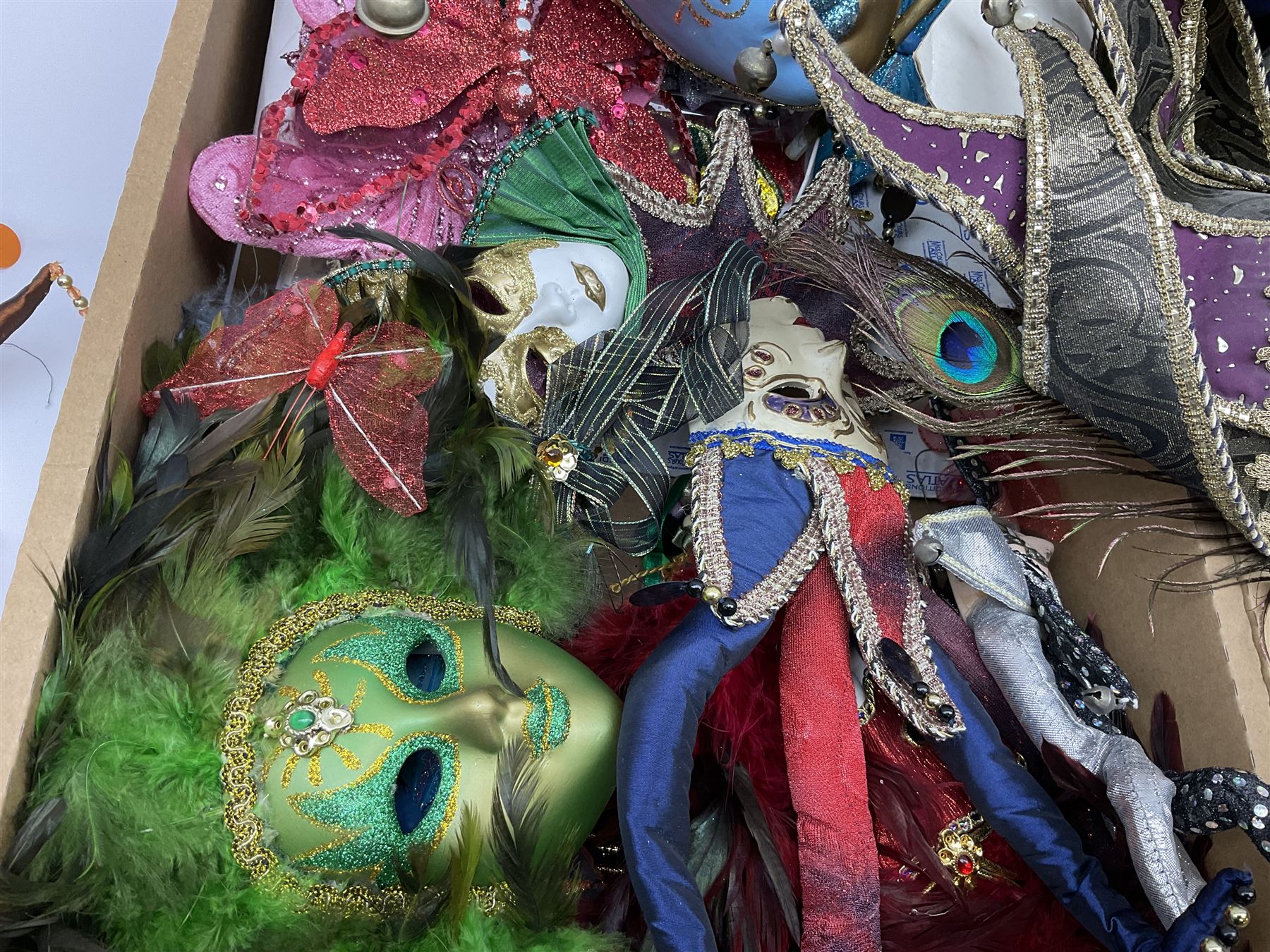 Large collection of decorative Venetian masks, to include two bearing tags for La Maschera Del Galeone, in two boxes 