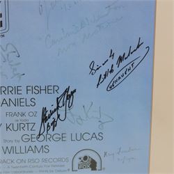Autographed 1980s Star Wars Empire Strikes Back movie poster, with artwork by Tom Jung, with signatures including Michael Sheard (Admiral Ozzel), Koo Stark, Caroline Blakiston (Mon Mothma), Shelagh Fraser (Aunt Beru), Mike Edmonds (Logray), Peter Mayhew (Chewbacca), Jeremy Bulloch (Boba Fett), Stuart Freeborn (Creature Designer), Warwick Davies (Wicket), Michael Carter (Bib Fortuna), Dave Prowse (Darth Vader), Kenny Baker (R2D2), signatures and poster obtained at the Dave Prowse Promotions Mulitcon Event 1998 at The Norbreck Caste Hotel, Blackpool, in glazed black frame, frame H115cm
