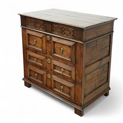 John Nethercott & Co - late 20th century hand-made oak 17th-century design chest of drawers, rectangular pegged and planked top above scrollwork carved frieze concealing two drawers, over three drawers, all with raised rectangular moulding and drop handles, raised on stile feet, the back with dated label for John Nethercott & Co