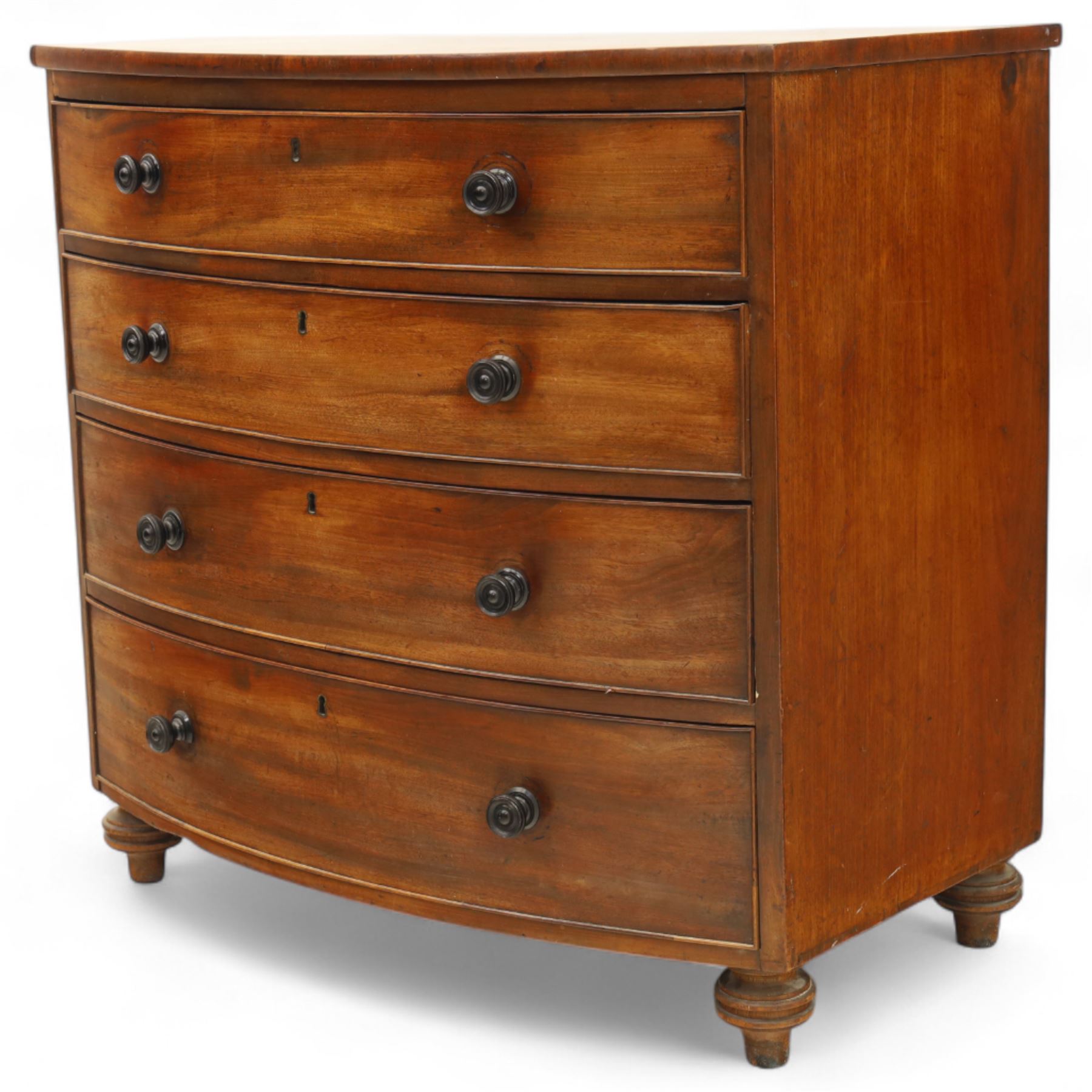 Mid-19th century mahogany bow front chest, fitted with four graduating drawers, turned ebonised handles, bun feet