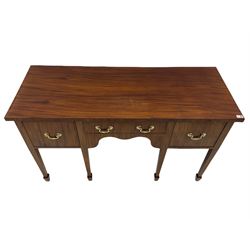 Early 19th century mahogany sideboard, straight front figured top over two cupboards and single drawer, square tapering supports with spade feet