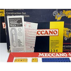 Meccano - Outfits 2, 3 & 4 with blue and yellow parts; look to be virtually complete with most apertures filled; together with a partially stocked Meccano Elekrikit; all boxed with instruction manuals (4)