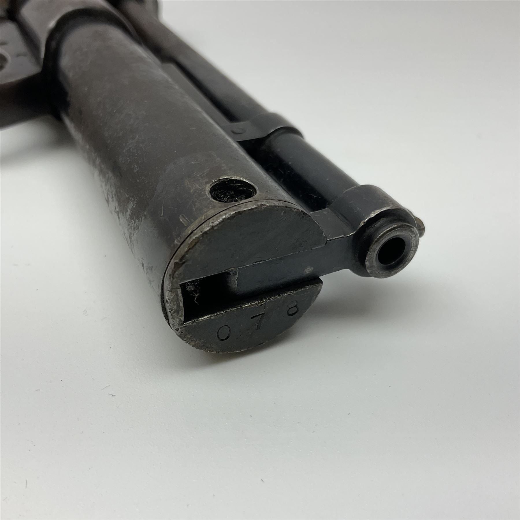 Webley 'Junior' .177 air pistol with top lever action and wooden grips; marked The Webley Junior .177 Webley & Scott Ltd Birmingham 4 Made in England to left side of cylinder; numbered 078 to muzzle and J3007 to trigger guard; L21cm; together with part tin of Webley .177 Special Pellets NB: AGE RESTRICTIONS APPLY TO THE PURCHASE OF THIS LOT.