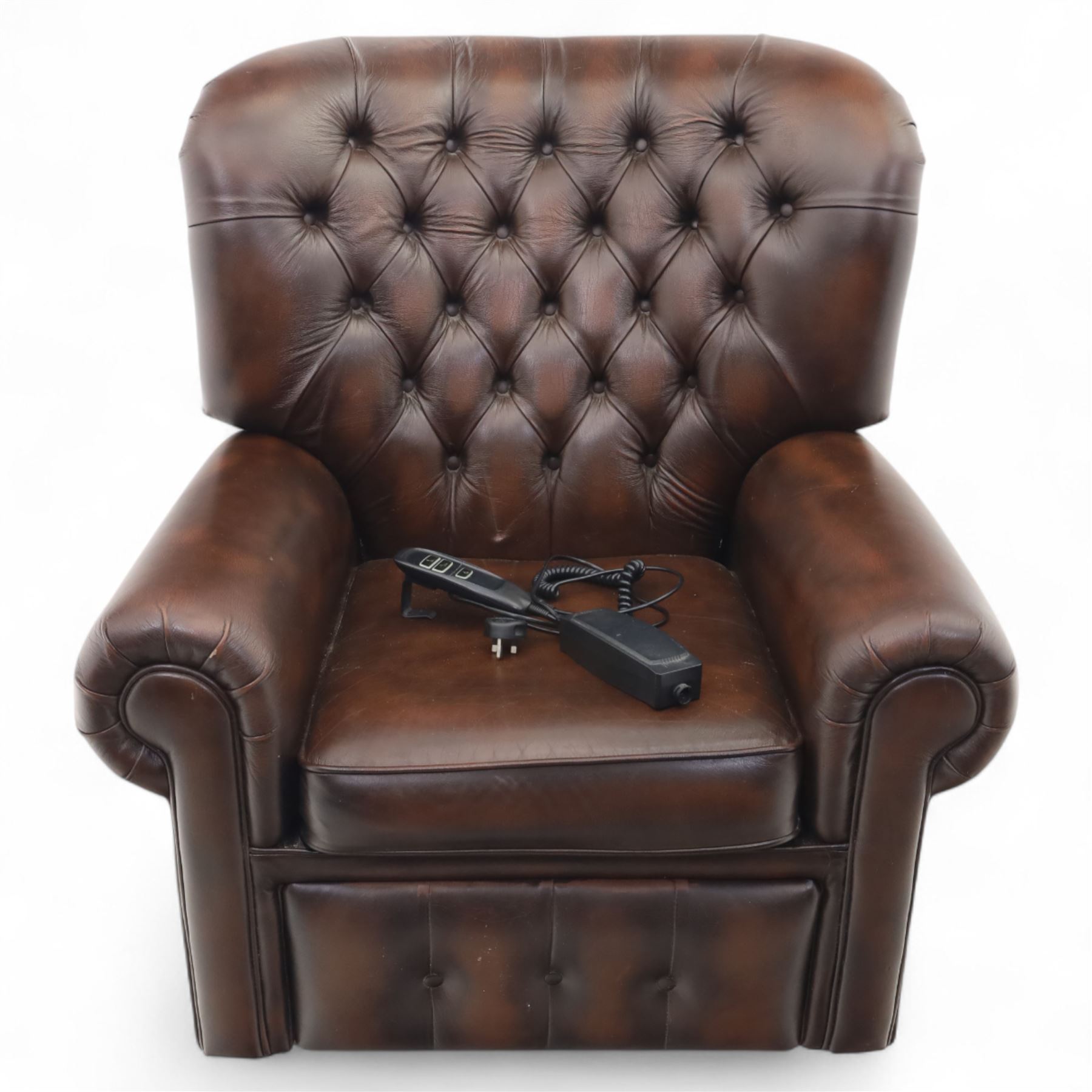 Thomas Lloyd  - electric reclining armchair, brown leather,  button upholstered back, cushion seat, and wide scrolled arms, raised on bun feet 