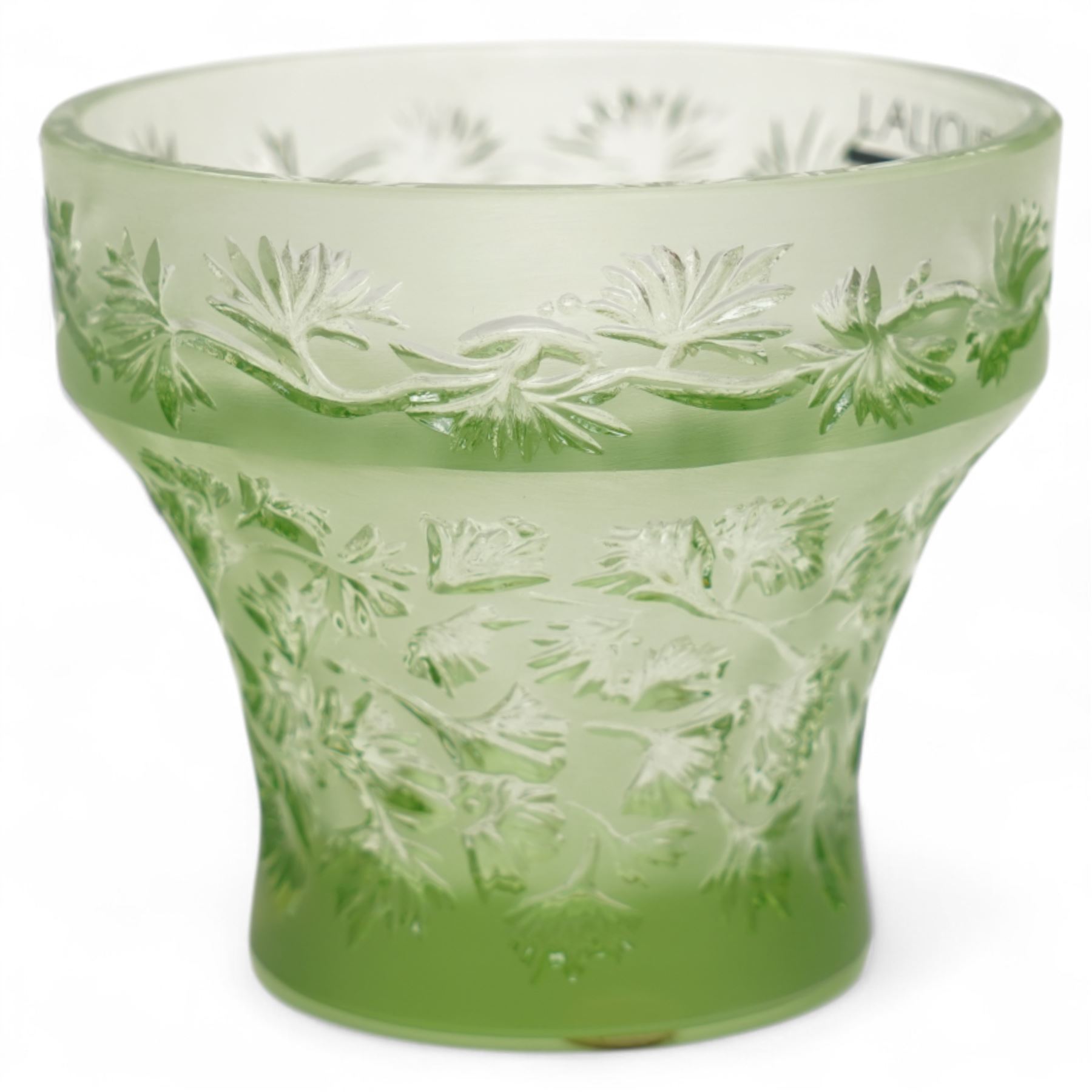 Lalique green glass tea light holder decorated with the coriandre pattern H8cm, another in the basil pattern H8cm and another with trailing leaves H8cm, all signed 'Lalique, France'