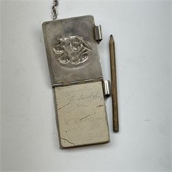 Victorian and later silver chatelaine, the shaped and foliate pierced clasp with embossed oval panel of a courting couple, hallmarked Levi & Salaman, Birmingham 1899, supporting six accessories on five chains: a circular mirror embossed with putti, hallmarked Henry Matthews, Birmingham 1911, pencil holder engraved with foliate scrolls, hallmarked Francis Webb, Birmingham 1914, conical scent bottle decorated with bamboo, (unmarked but testing as silver), aide memoire embossed with putti, hallmarked Samuel M Levi, Birmingham 1911, tape measure of compressed spherical form, hallmarked Henry Matthews, Birmingham 1899, and a purse with embossed putti, hallmarked Birmingham 1909, makers mark worn and indistinct, at longest point L31cm

