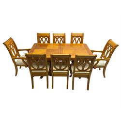 Yew wood extending twin pedestal dining table, rectangular top with ebony stringing over turned and reeded vasiform pedestals on tripod bases, with two additional leaves (W159cm D92cm); and set of eight (6+2) matching dining chairs, high pierced backs over seats upholstered in ivory fabric, on cabriole supports (W57cm H101cm)