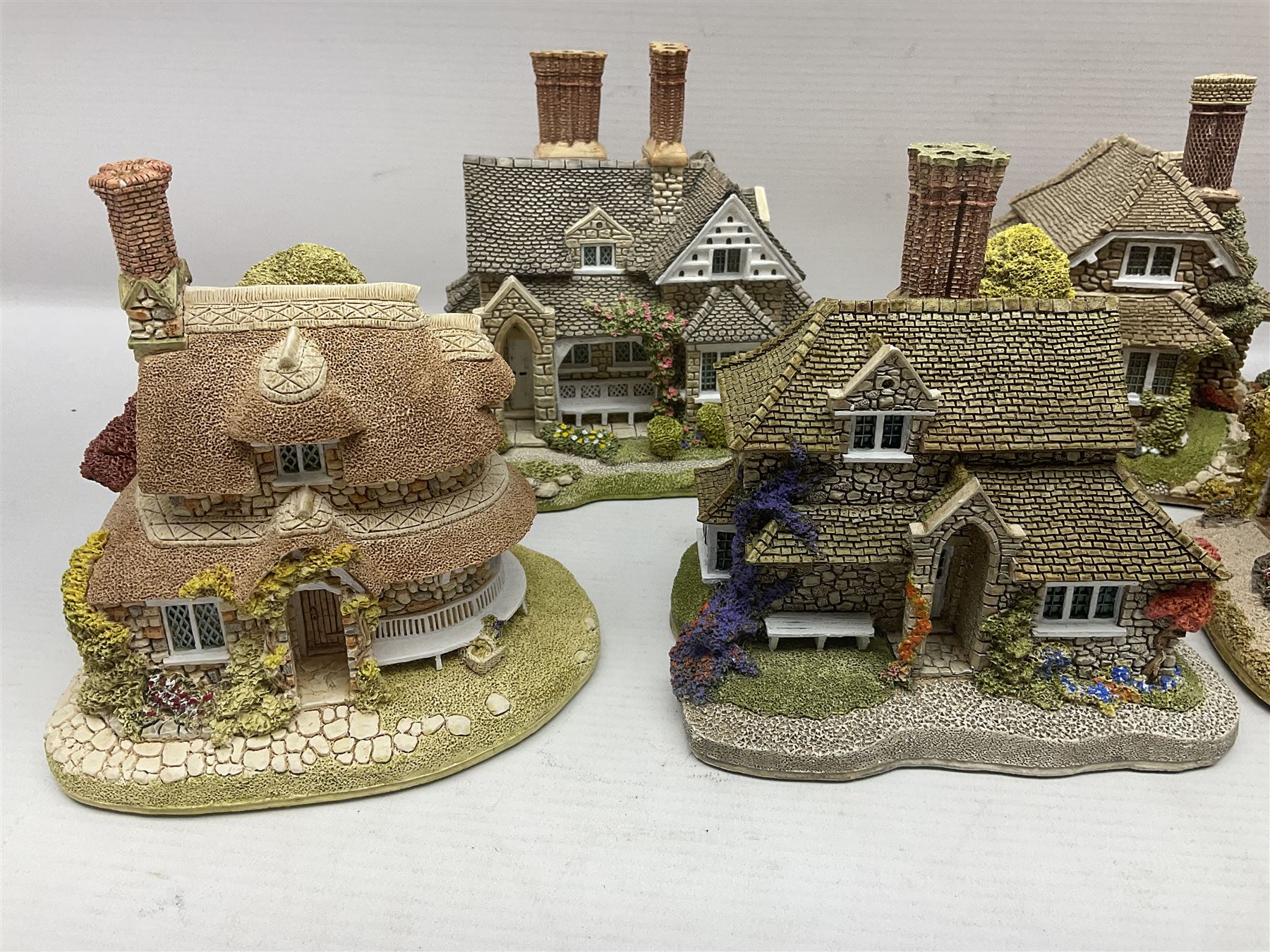 Eight Lilliput Lane limited edition Beatrix Potter models, including Buckle Yeat, Tabitha Twitchits Shop and Ginger Pickles Shop, together with twelve Lilliput Lane models from the Blaise Hamlet collection, including Dial Cottage, Diamond Cottage and Vine Cottage, all with deeds and original boxes (20)