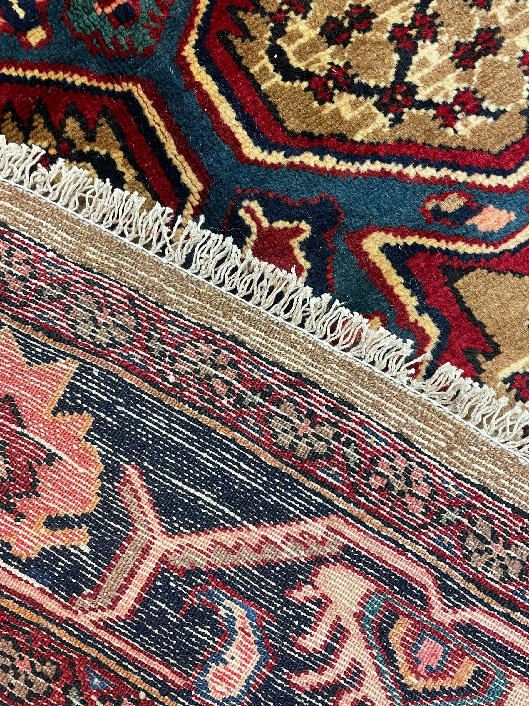 North West Persian Bidjar rug, large floral design shaped pole medallion on a brown field decorated with lattice pattern, the border decorated with trailing branch and stylised plant motifs