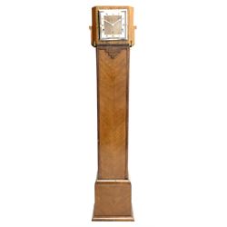 Art Deco period walnut grandmother/mantel clock, the removable mantel clock with square dial and silvered Roman chapter ring, triple train driven chiming movement, on later stand with book matched veneers