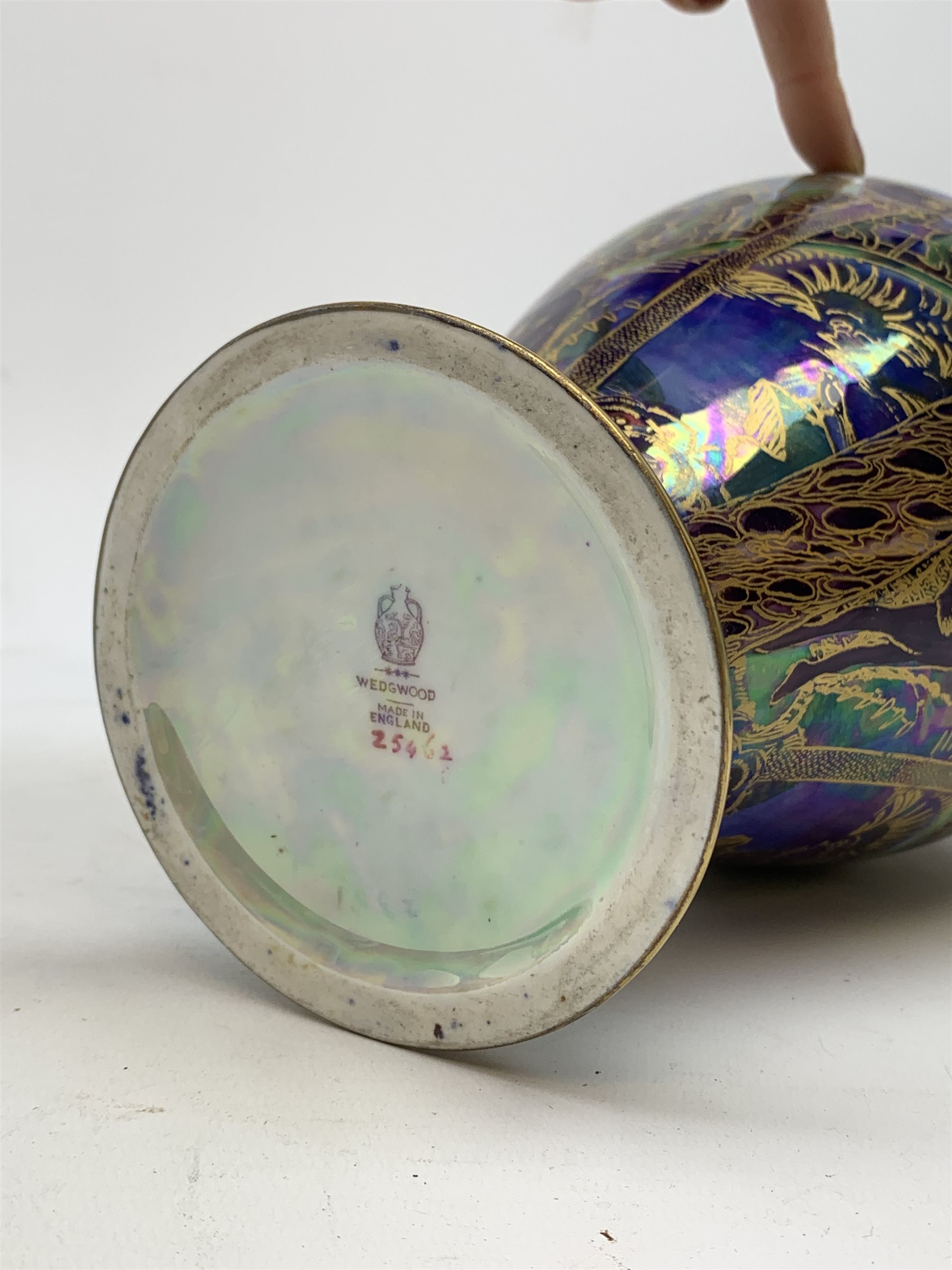 Wedgwood Fairyland Lustre vase, designed by Daisy Makeig Jones, of baluster form decorated with the Imps on a Bridge pattern, painted with a procession of imps crossing a bridge set within a fantasy landscape, heightened with gilt detail throughout, with printed and painted marks beneath, H22.5cm