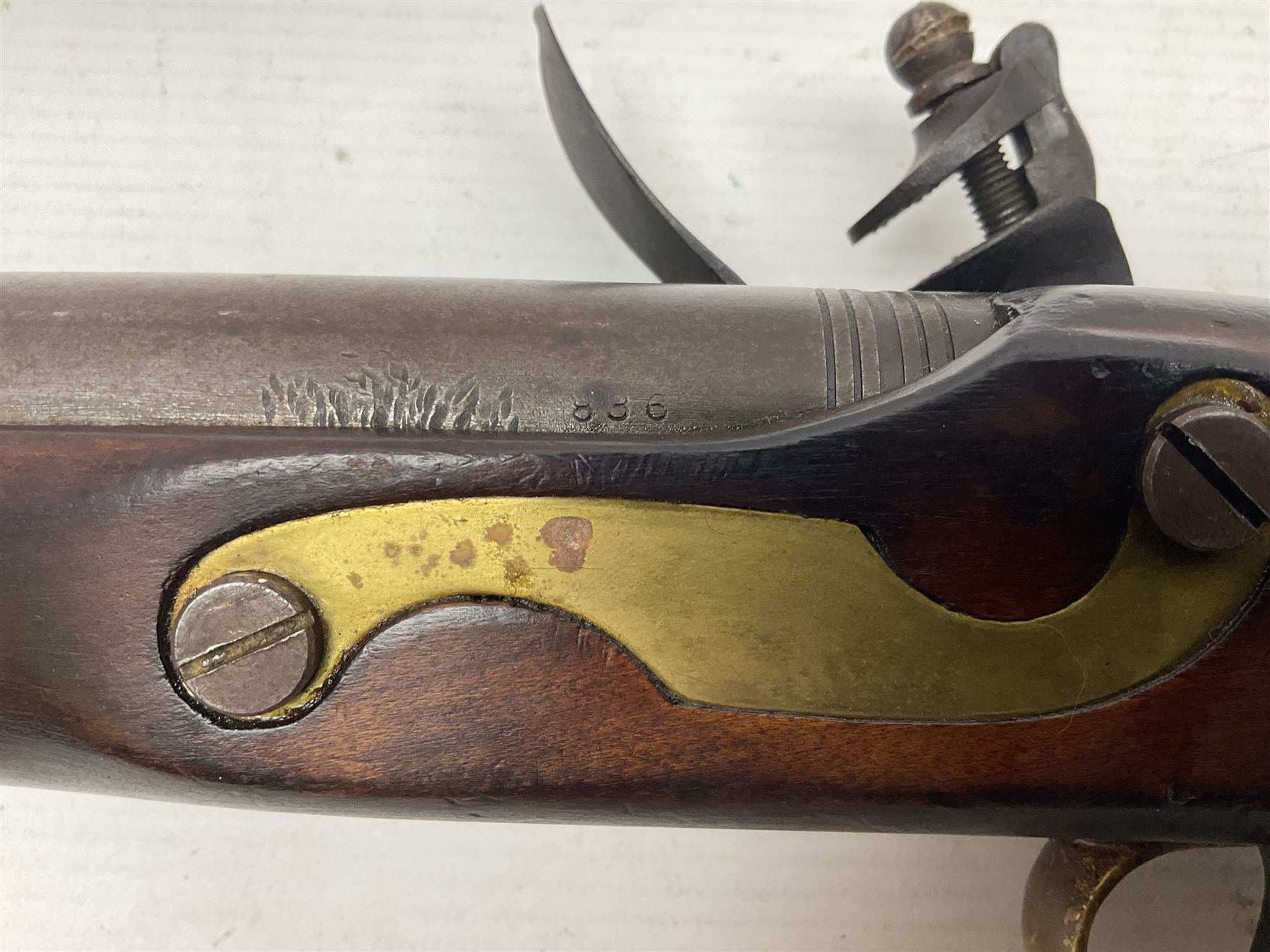 Modern non-firing reproduction Tower flintlock pistol marked with crowned GR and Tower to the lock, brass skull crusher butt and fittings L40cm overall; another Indian/Moorish reproduction flintlock pistol with mother-of-pearl inlay; and a modern die-cast replica Colt style revolver (3)