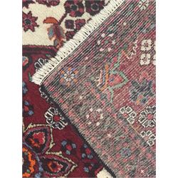Persian Heriz wool rug, red and ivory field with floral medallion, geometric spandrels, and floral border (157cm x 107cm); Kurdish Shairwan wool rug, red and navy field with three medallions, geometric crosses and serrated border (200cm x 155cm); Persian Qashqai wool rug, golden-yellow field with boteh motifs and wide floral border (127cm x 82cm)