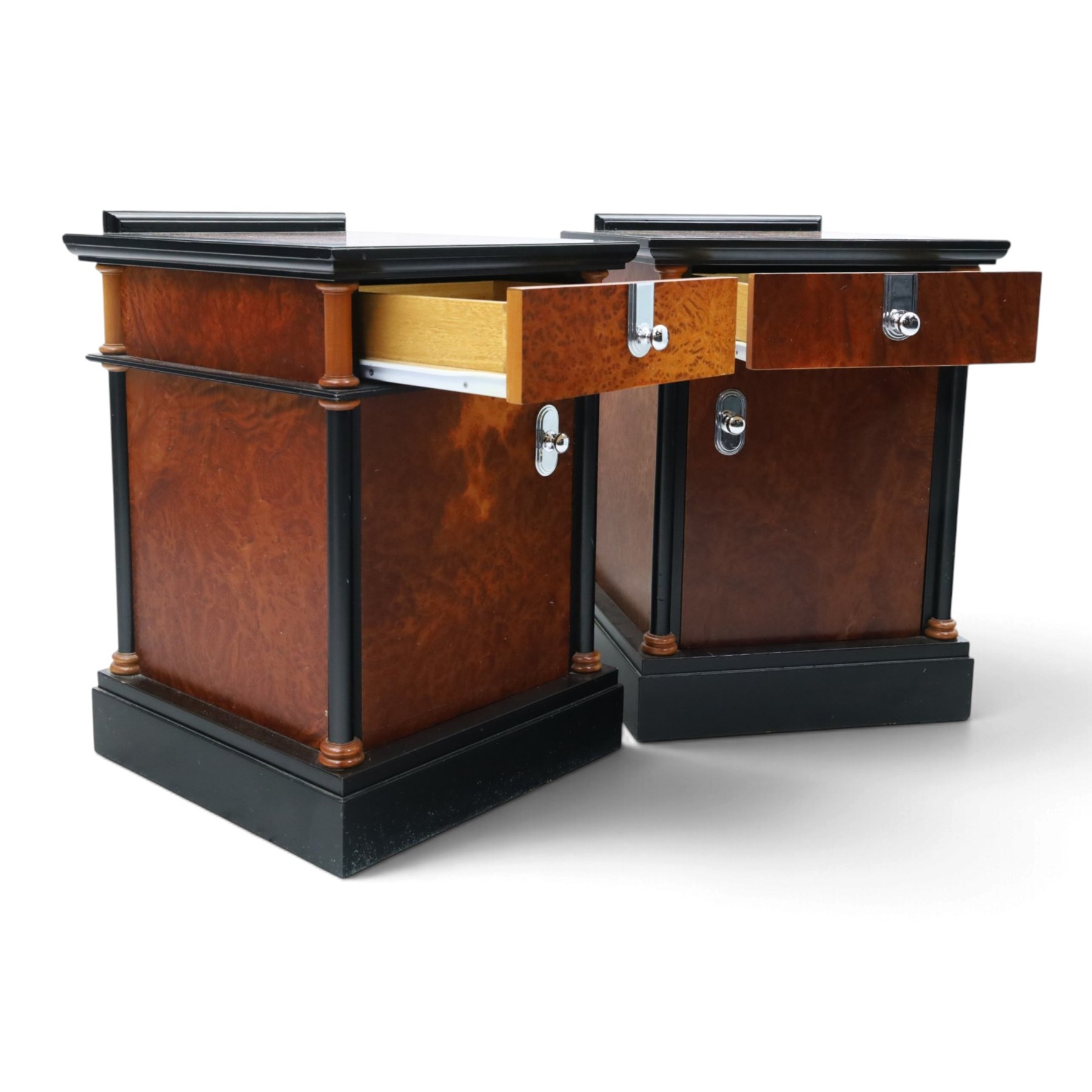 Pair of Art Deco design burr walnut and ebonised bedside cabinets, rectangular inset tops with raised rear galleries, each fitted with a drawer above a cupboard, flanked by cylindrical columns, on plinth bases