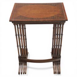 20th century mahogany quartetto nest of tables, the rectangular tops with oval inlay, upon turned knopped supports, united by a curved stretcher, raised upon outswept feet