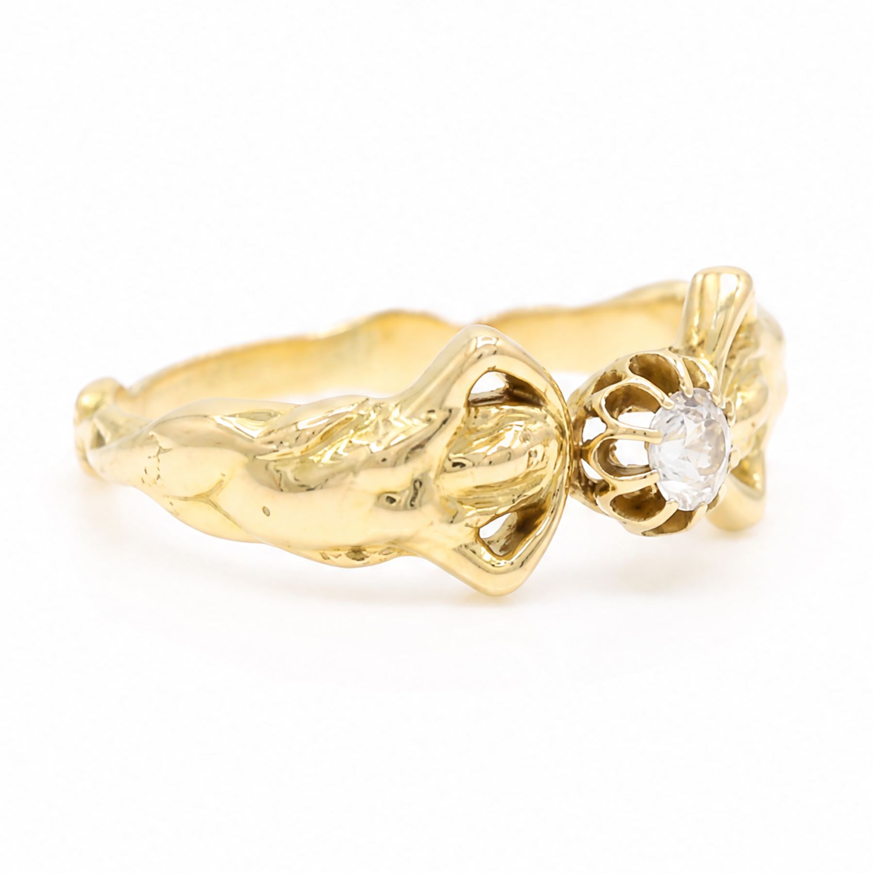 Gold diamond figural ring, single old cut diamond of approx 0.45 carat, with a nude female figure either side, stamped 18ct