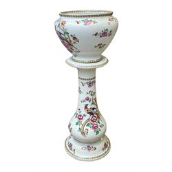 Large ceramic Jardiniere on stand, decorated with an oriental pheasant perched upon branches blossoming with peonies and foliage on white ground, overall H99cm