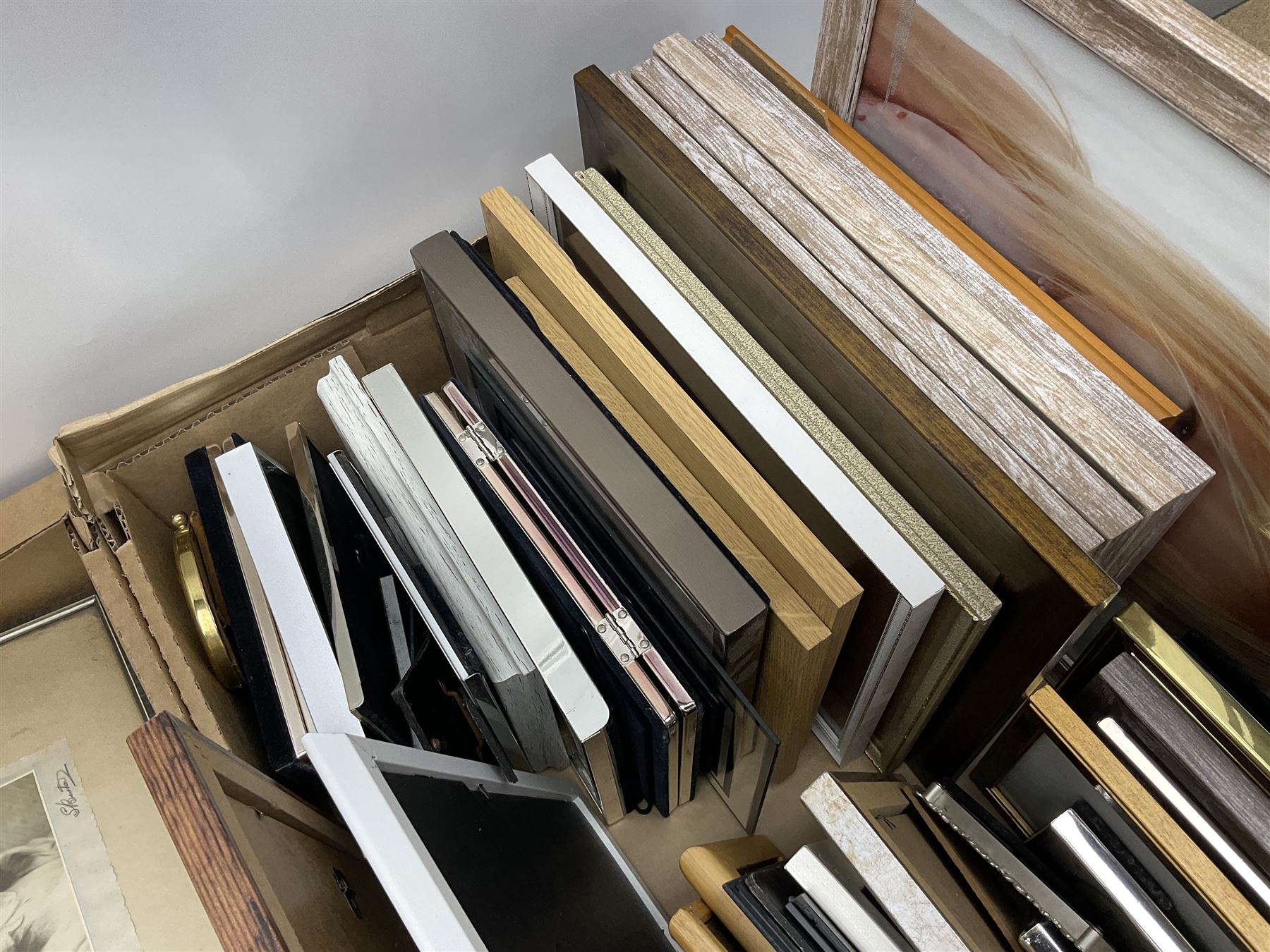 Large quantity of photograph frames, to include wooden, metal, glass and enamel examples, in two boxes 