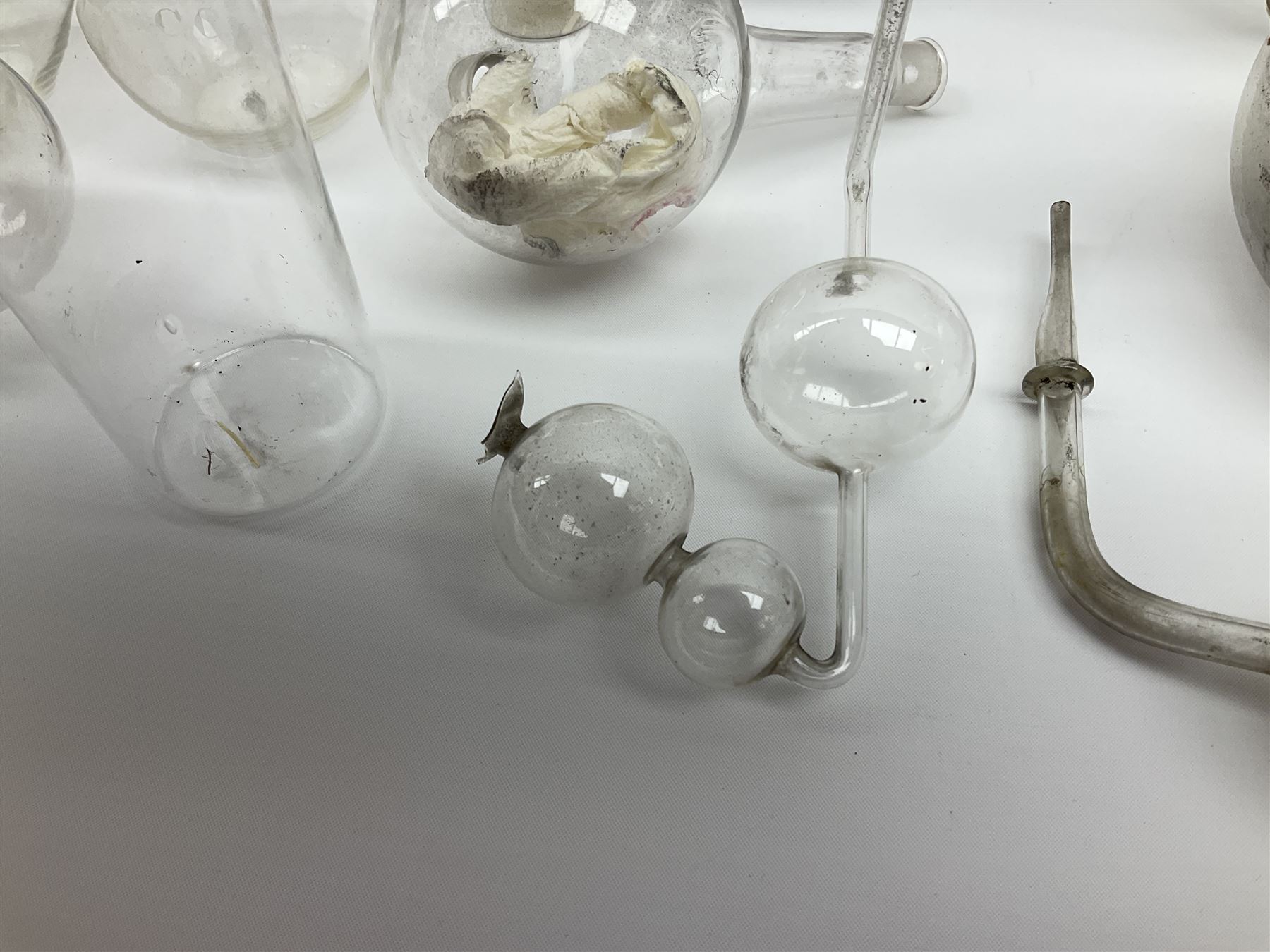 Collection of 19th century and later pharmaceutical laboratory glass, to include, volumetric flasks of various sizes, conical flask, stratus flask, etc (25) Provenance: discovered in the storeroom of a long established Hull pharmacist and opticians