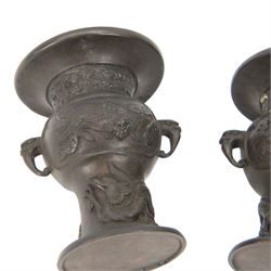 Pair of Japanese bronzed vases, decorated in relief with with birds and dragons, with dragon head handles, H13cm