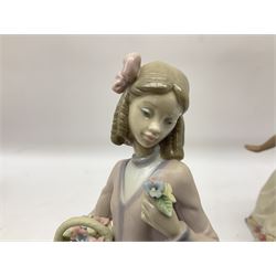Four Lladro figures, comprising Carefree, gres finish, no 2288, Innocence in Bloom, no 7644, Pretty Pose, no 5589 and Blustery Day, no 5588, all with original boxes, largest example H22cm