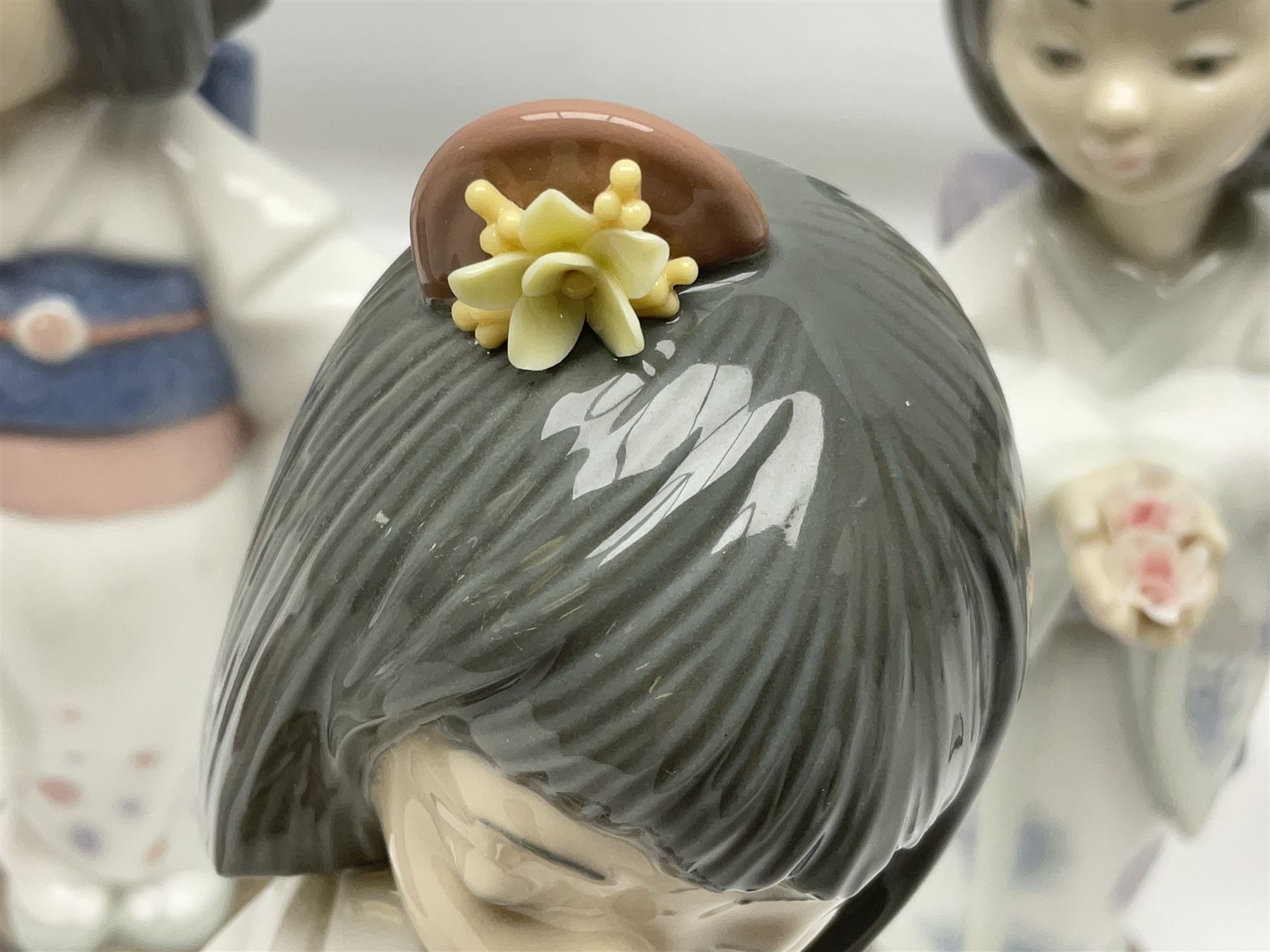 Six Lladro figures of the China doll set and Oriental doll set, comprising Playing the Flute no.6150, Bearing Flowers no.6151, Flower Gazer no. 6152, Oriental Dance no. 6230, Oriental Lantern no. 6231 and Oriental Beauty no. 6232, largest H20cm