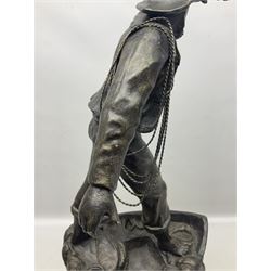 Early 20th century spelter effect figure of a sailor standing in the bow of a boat scanning the horizon, on a simulated rock base with a plaque entitled 'Rescue', base fitted with a timepiece clock movement and two-part dial, with pierced hands, gilt dial centre and ivorene chapter ring written in Arabic numerals, German HAC spring driven going barrel movement wound from the front; with pendulum H65.5cm
