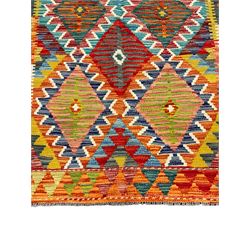 Chobi Kilim rug, multi-coloured ground in oranges, blues and greens, overall geometric design 