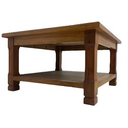 Acorn Industries - yew two-tier coffee table, square top, raised on chamfered supports, carved acorn signature to foot, by Alan Grainger of Brandsby