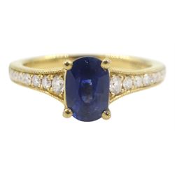 18ct gold oval sapphire ring, with diamond set shoulders, hallmarked