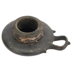 Etruscan terracotta oil lamp, with black glaze, flat loop handle and laurel leaf border, the opening with later turned wooden collar, signed to base 'repaired by one James Naysmith 1887', H7cm 