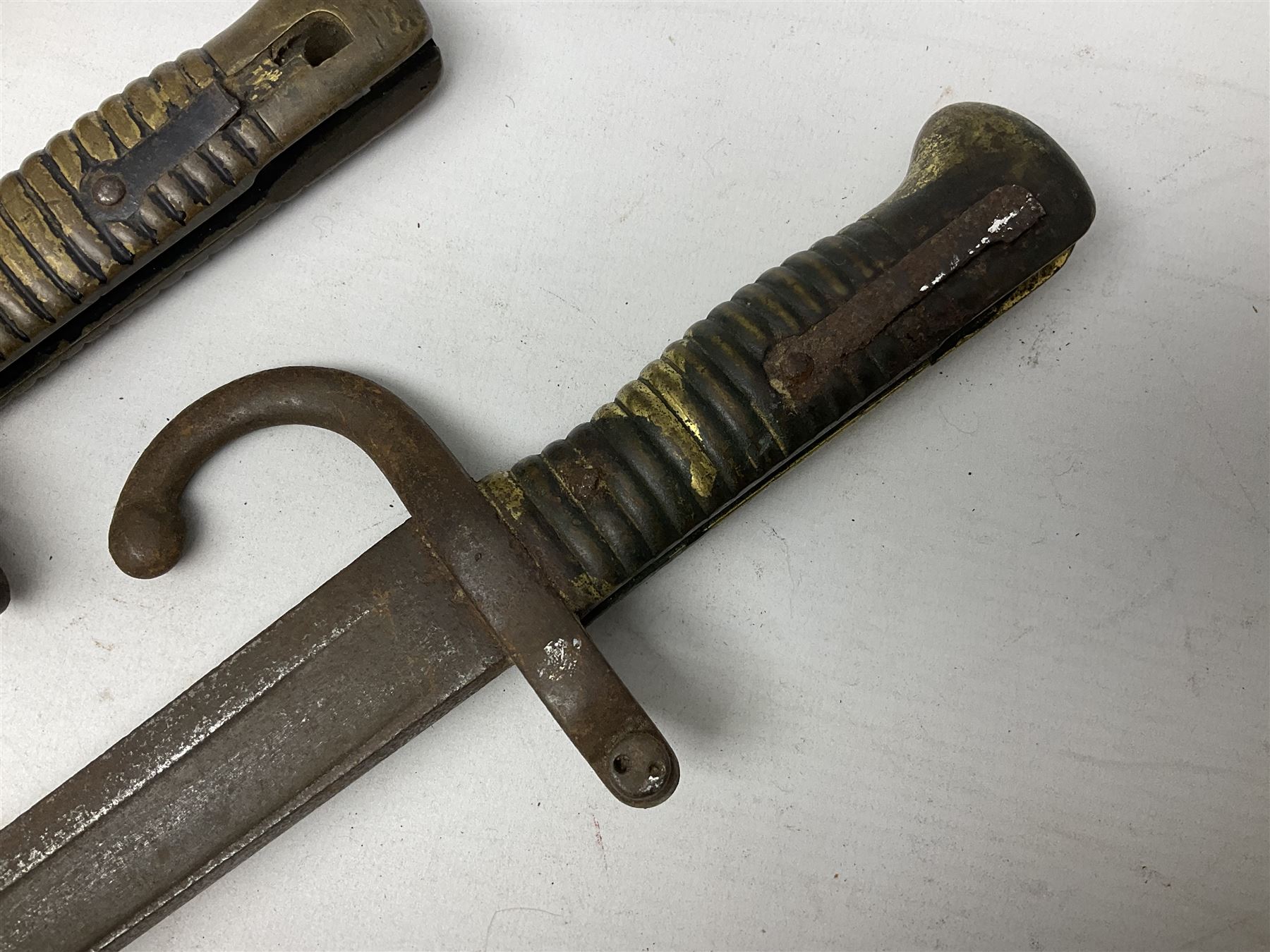 Five 19th century bayonets in relic condition without scabbards comprising British Pattern 1876 socket bayonet with Indian markings; French Model 1874 epee bayonet; and three French Model 1866 sabre bayonets (5)