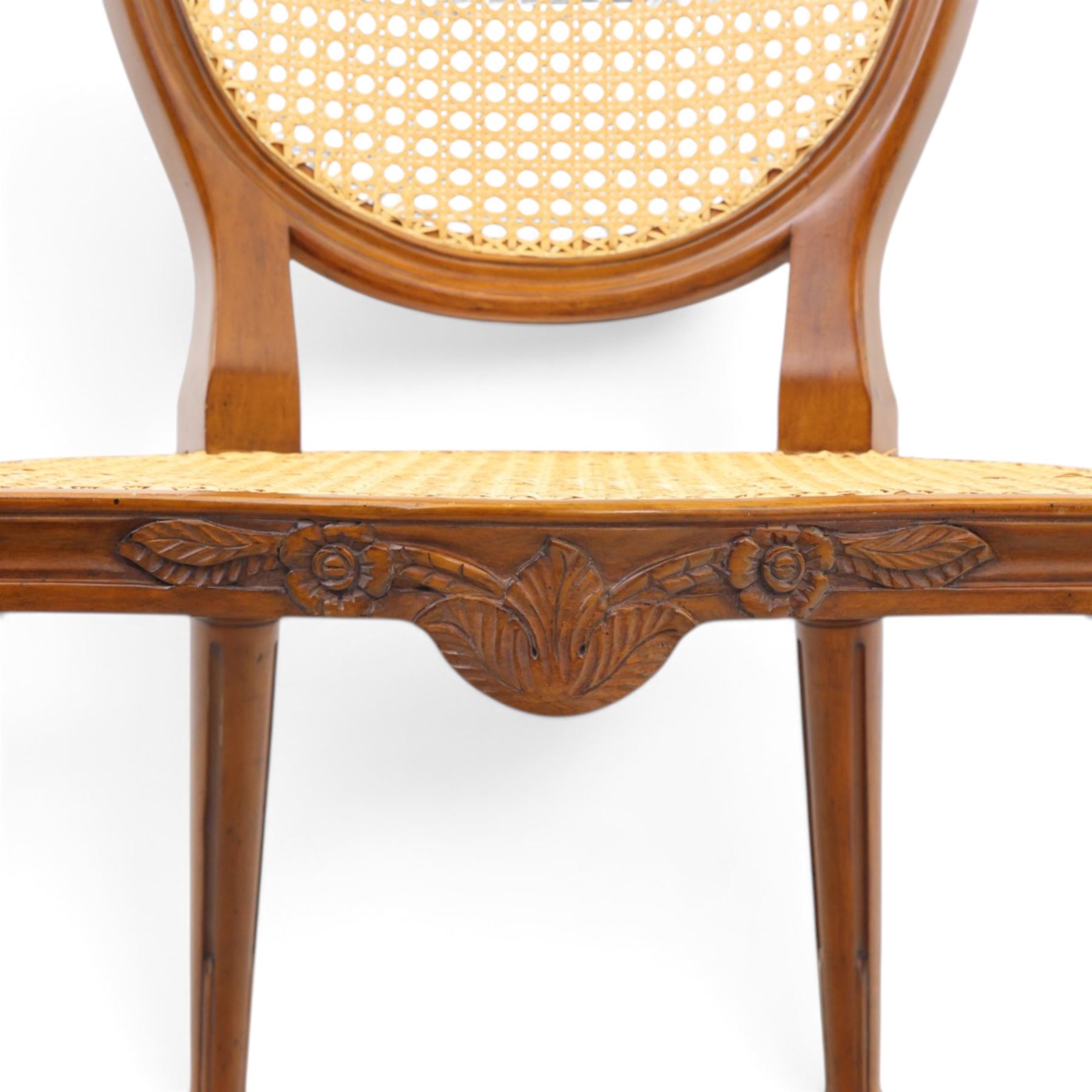 And So To Bed - French design 'Floral Caned Chair', balloon caned back with foliate carving, above a caned serpentine seat, reeded and turned supports