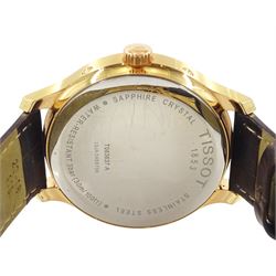 Tissot Tradition Perpetual Calendar gentleman's gold-plated and stainless steel quartz wristwatch. Ref. T063637 A, silvered dial with dagger hour markers and Arabic 12 o'clock, on original brown leather strap, with fold-over clasp, cased and boxed with additional parts