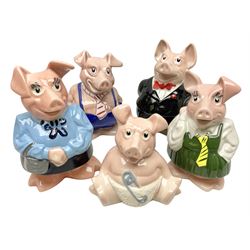 Set of five Wade NatWest money boxes, comprising father, mother, boy, girl and baby, four with original boxes 